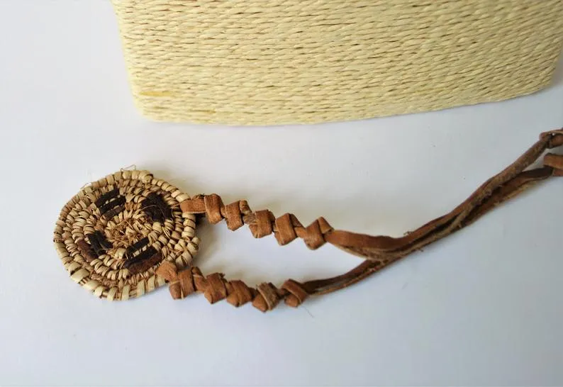 African necklace from natural leather and palm straw