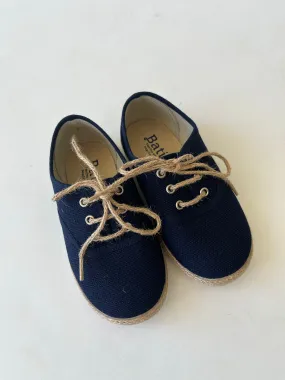 Navy canvas with jute sole and tie.