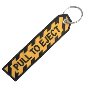 PULL TO EJECT BLACK AND GOLD KEYCHAIN